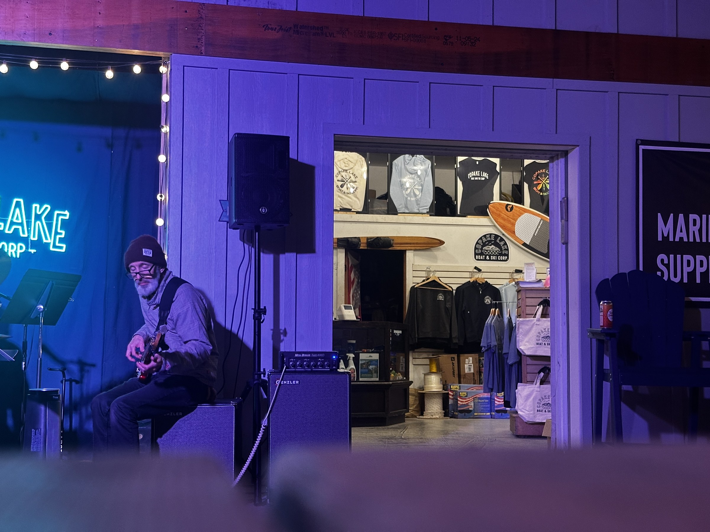 A musician performing beside the marina shop at Copake Lake Boat and Ski